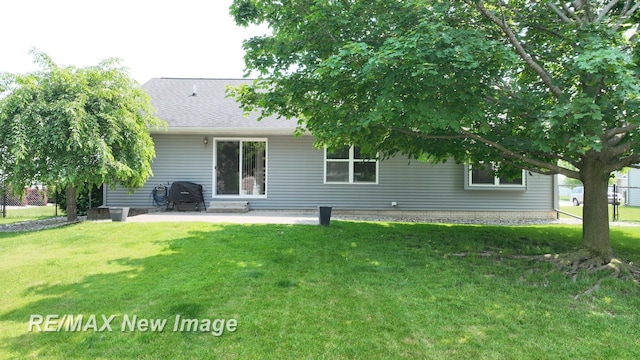 3137 Sundown Ln, Saginaw, MI 48603 - back of house with a patio and roof with shingles