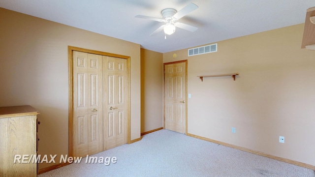 3137 Sundown Ln, Saginaw, MI 48603 - unfurnished bedroom featuring carpet floors, a closet, and a ceiling fan