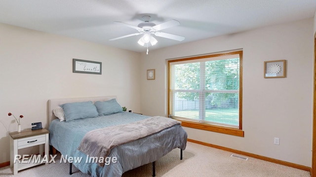 3137 Sundown Ln, Saginaw, MI 48603 - bedroom with carpet and ceiling fan