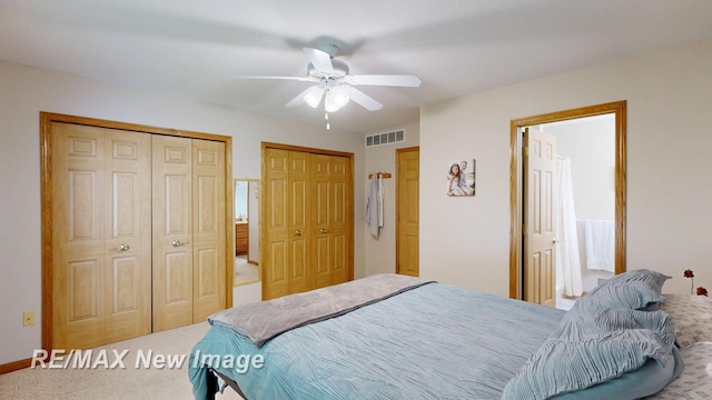 3137 Sundown Ln, Saginaw, MI 48603 - bedroom featuring multiple closets, carpet flooring, and ceiling fan