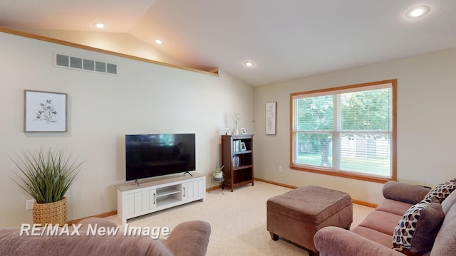3137 Sundown Ln, Saginaw, MI 48603 - living area with lofted ceiling, light colored carpet, and recessed lighting