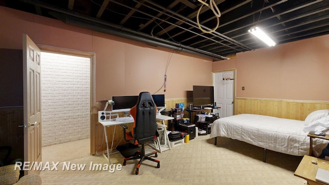 3137 Sundown Ln, Saginaw, MI 48603 - carpeted bedroom with wainscoting and wooden walls