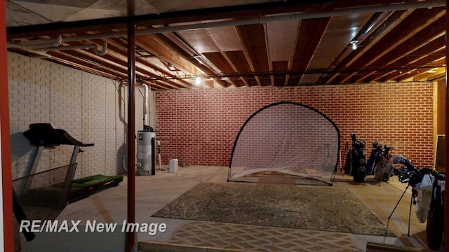 3137 Sundown Ln, Saginaw, MI 48603 - unfinished basement with water heater and brick wall