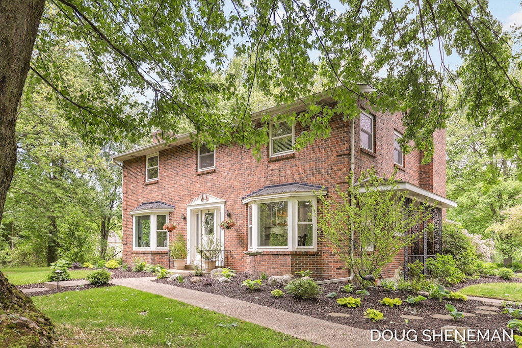 9679 Port Sheldon St, Zeeland, MI 49464 - view of front facade with brick siding and a front yard