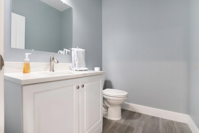 14110 168th Ave, Grand Haven, MI 49417 - half bathroom featuring vanity and wood finished floors