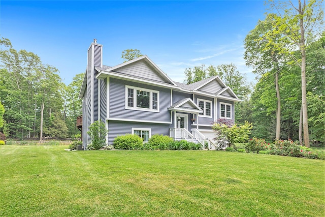 14110 168th Ave, Grand Haven, MI 49417 - bi-level home with a chimney and a front yard