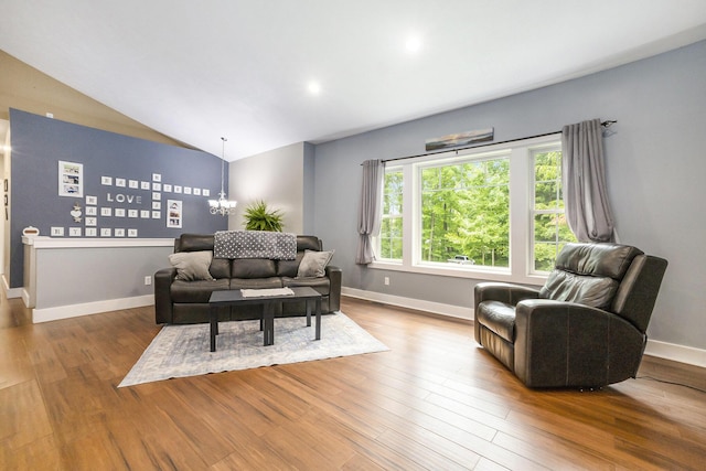 14110 168th Ave, Grand Haven, MI 49417 - living room with wood finished floors, a chandelier, and lofted ceiling