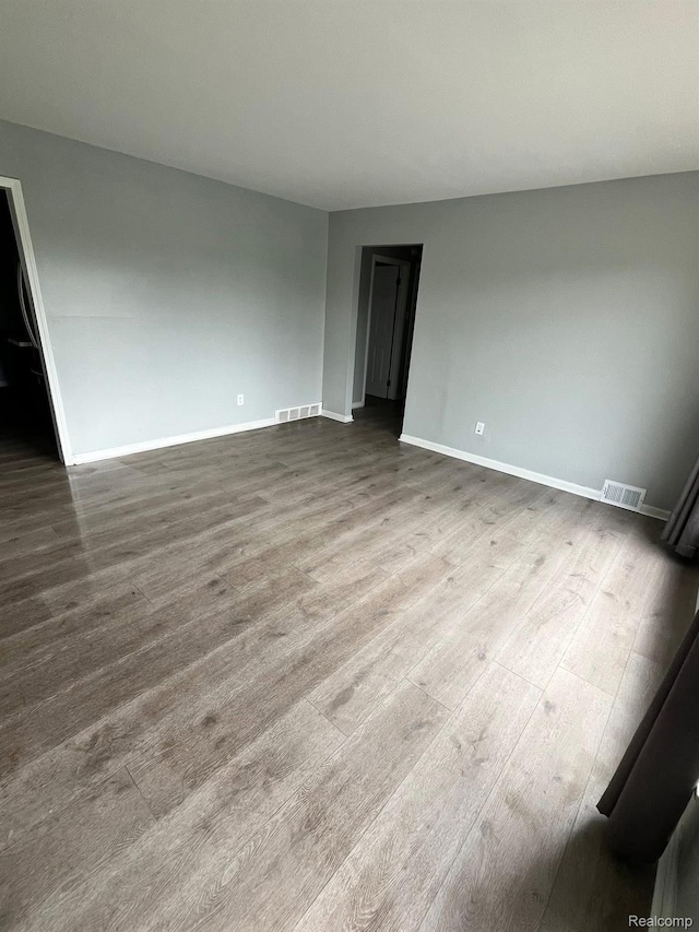 1435 Jeffrey Ln, Inkster, MI 48141 - spare room with dark wood finished floors and baseboards