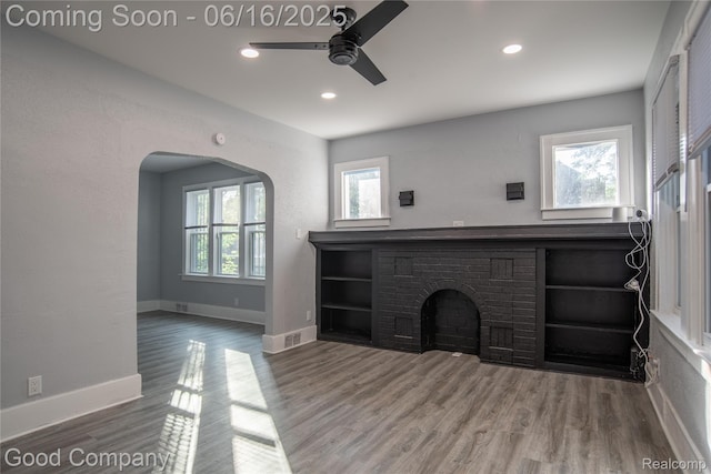 5217 Lakeview St, Detroit, MI 48213 - unfurnished living room featuring a ceiling fan, wood finished floors, recessed lighting, and arched walkways