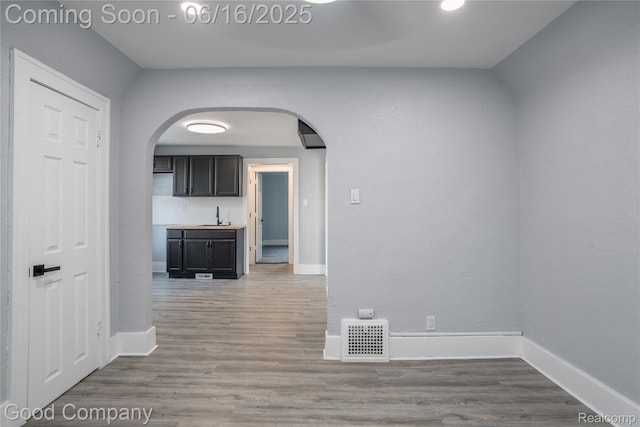 5217 Lakeview St, Detroit, MI 48213 - corridor with arched walkways and wood finished floors