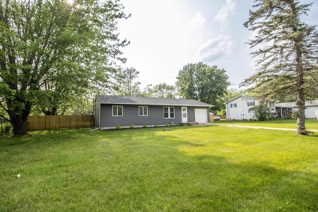 9461 Morrish Rd, Montrose, MI 48457 - back of property with asphalt driveway and a garage