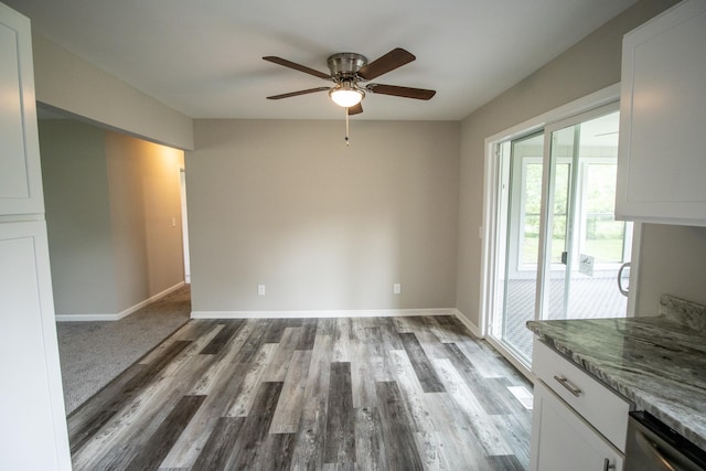 9461 Morrish Rd, Montrose, MI 48457 - unfurnished dining area with a ceiling fan and wood finished floors