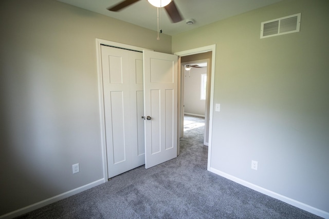 9461 Morrish Rd, Montrose, MI 48457 - unfurnished bedroom with carpet flooring, a closet, and a ceiling fan