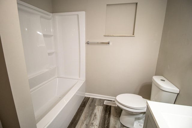9461 Morrish Rd, Montrose, MI 48457 - bathroom featuring wood finished floors, vanity, and shower / bath combination