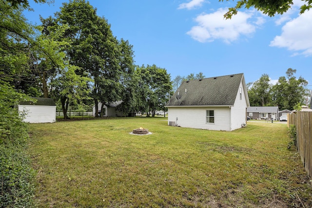 5747 Utah Ave, Portage, MI 49024 - view of yard featuring an outdoor fire pit and a storage shed