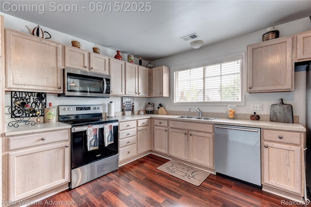 28498 Carlton Way Dr, Novi, MI 48377 - kitchen with stainless steel appliances, light brown cabinets, light countertops, and dark wood-type flooring