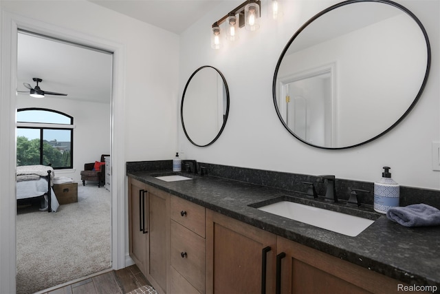 2584 Heights View Ct, Rochester, MI 48306 - ensuite bathroom with double vanity, a ceiling fan, and wood finished floors