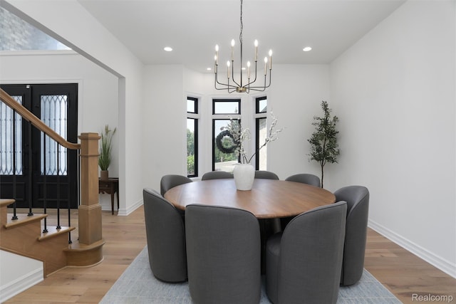 2584 Heights View Ct, Rochester, MI 48306 - dining room featuring a chandelier, stairway, light wood-style flooring, and recessed lighting
