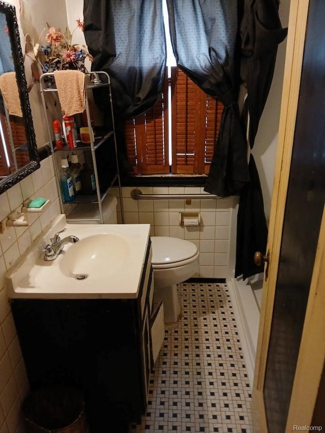 20527 Greeley St, Highland Park, MI 48203 - bathroom featuring tile walls, vanity, tile patterned floors, and decorative backsplash