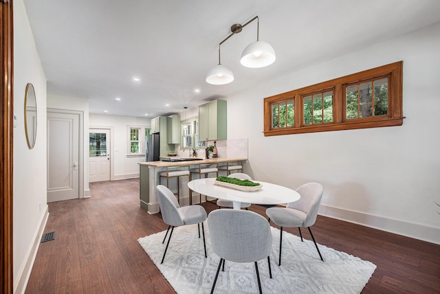 1412 4th St NW, Grand Rapids, MI 49504 - dining area featuring dark wood-style floors and recessed lighting