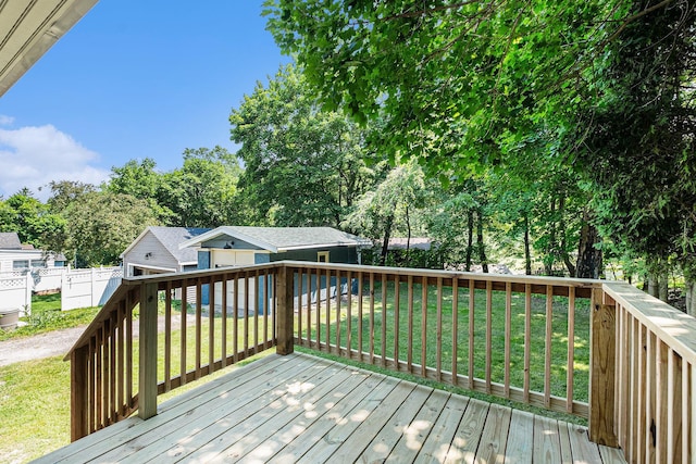 1412 4th St NW, Grand Rapids, MI 49504 - deck with an outdoor structure and view of wooded area
