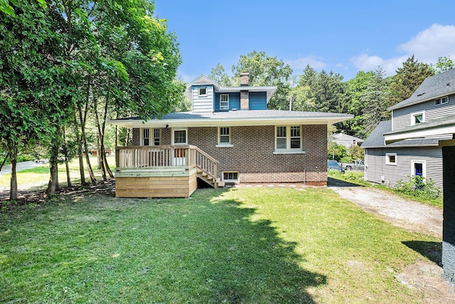 1412 4th St NW, Grand Rapids, MI 49504 - rear view of property featuring a chimney, brick siding, a lawn, and a wooden deck