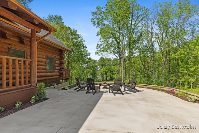 5820 Grace Hwy, Sunfield, MI 48890 - view of patio / terrace featuring an outdoor fire pit