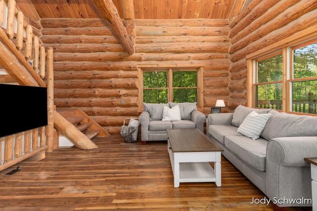 5820 Grace Hwy, Sunfield, MI 48890 - living room featuring wooden ceiling, log walls, plenty of natural light, and hardwood / wood-style flooring