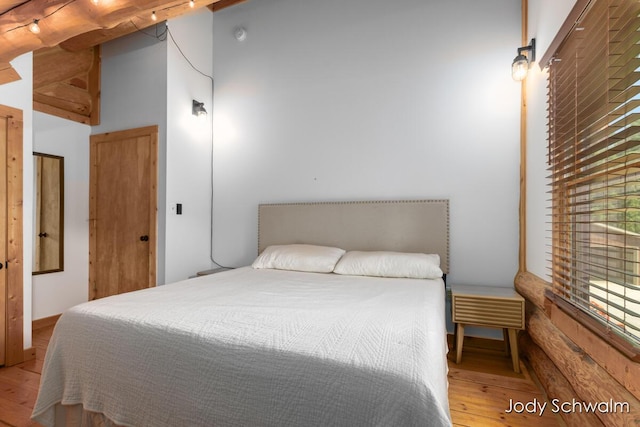 5820 Grace Hwy, Sunfield, MI 48890 - bedroom with hardwood / wood-style floors and a high ceiling