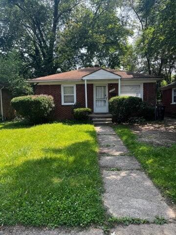 19506 Lahser Rd, Detroit, MI 48219 - view of front of house featuring brick siding and a front lawn