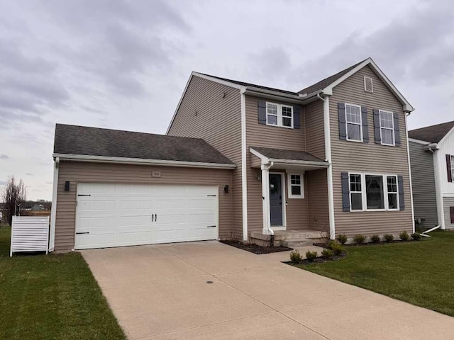 1131 Odell Farm Ln, Vicksburg, MI 49097 - traditional-style home with concrete driveway, a garage, and a front yard