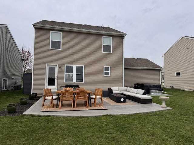 1131 Odell Farm Ln, Vicksburg, MI 49097 - rear view of house featuring a hot tub, an outdoor living space, a patio area, and a lawn