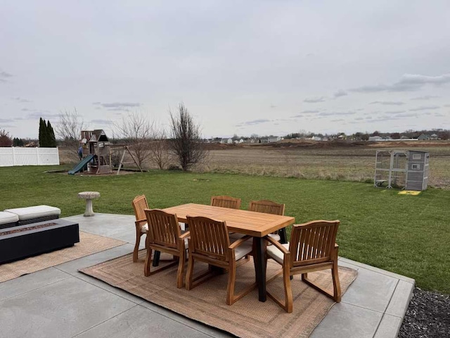 1131 Odell Farm Ln, Vicksburg, MI 49097 - view of patio with outdoor dining area and a playground