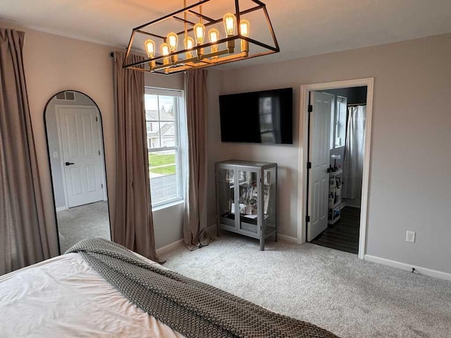 1131 Odell Farm Ln, Vicksburg, MI 49097 - carpeted bedroom featuring baseboards and a chandelier