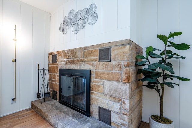 212 N Maple St, Saugatuck, MI 49453 - detailed view of a stone fireplace and wood finished floors