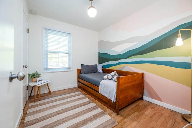 212 N Maple St, Saugatuck, MI 49453 - bedroom featuring wood finished floors and baseboards