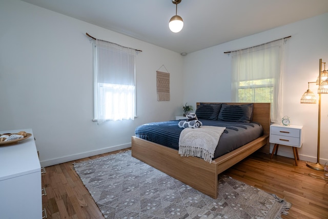 212 N Maple St, Saugatuck, MI 49453 - bedroom featuring multiple windows and wood finished floors