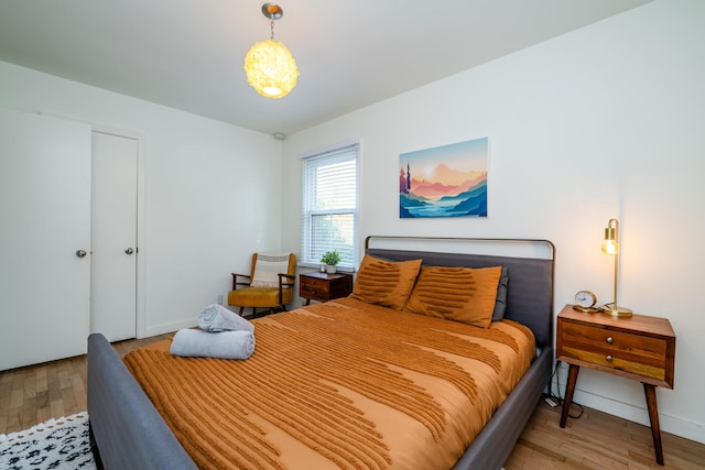 212 N Maple St, Saugatuck, MI 49453 - bedroom featuring light wood-style flooring and baseboards