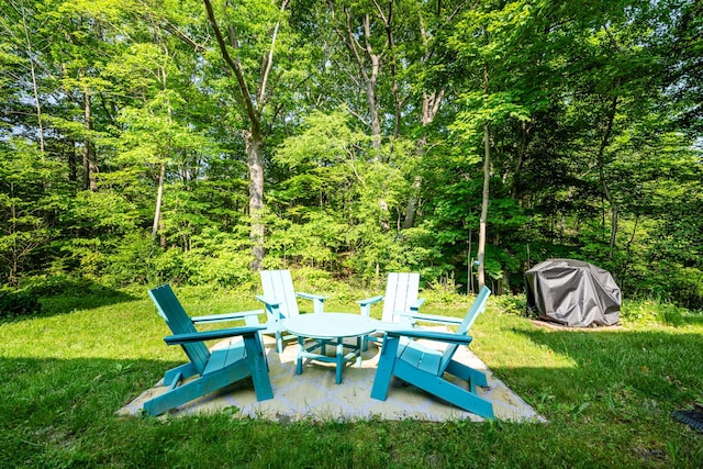 212 N Maple St, Saugatuck, MI 49453 - view of patio / terrace with area for grilling and a forest view