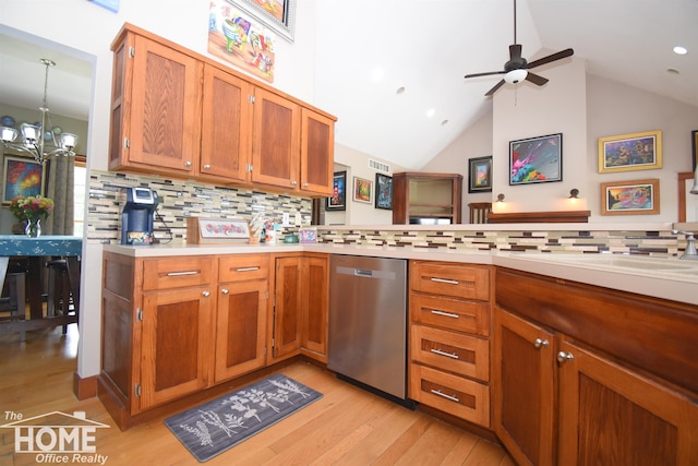 2411 Escott Rd, Owosso, MI 48867 - kitchen featuring stainless steel dishwasher, light countertops, light wood-type flooring, tasteful backsplash, and a ceiling fan