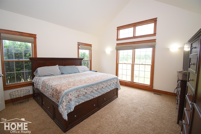 2411 Escott Rd, Owosso, MI 48867 - bedroom featuring light carpet and high vaulted ceiling