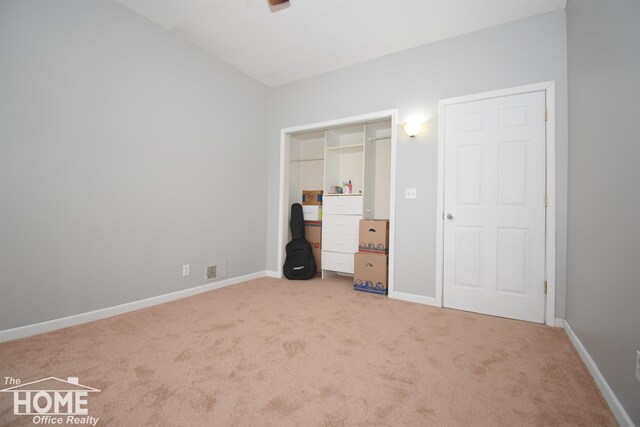 2411 Escott Rd, Owosso, MI 48867 - unfurnished bedroom with carpet flooring
