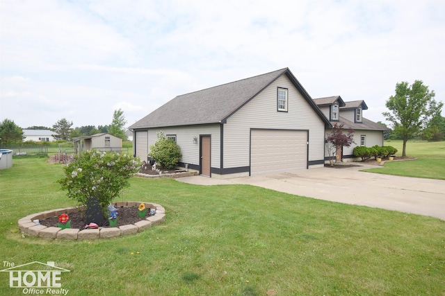 2411 Escott Rd, Owosso, MI 48867 - view of front facade featuring a garage, concrete driveway, and a shingled roof