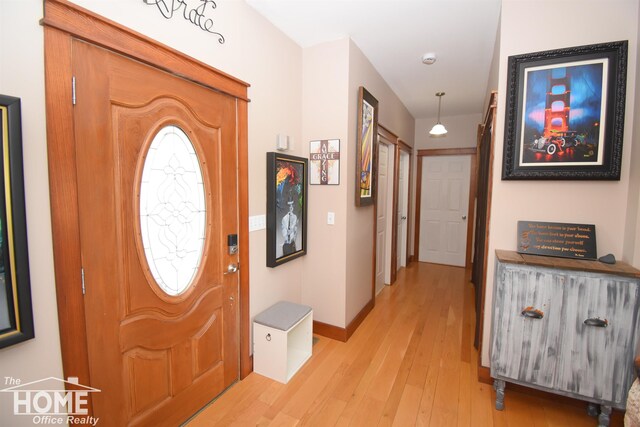 2411 Escott Rd, Owosso, MI 48867 - entrance foyer with light wood-style flooring and baseboards