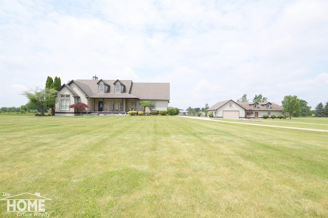 2411 Escott Rd, Owosso, MI 48867 - cape cod home with a front lawn