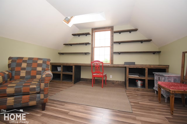 2411 Escott Rd, Owosso, MI 48867 - office space with vaulted ceiling, wood finished floors, and a skylight
