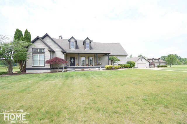 2411 Escott Rd, Owosso, MI 48867 - view of front of property featuring a porch, a front yard, a garage, and a chimney