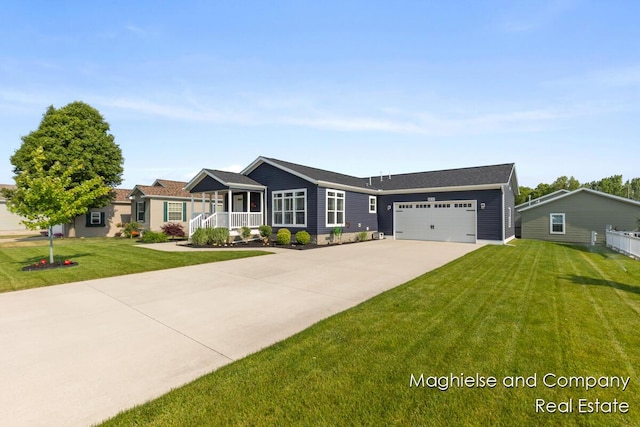 5231 E Scenic Turn Ln, Holland, MI 49423 - single story home with driveway, an attached garage, a front lawn, and a porch