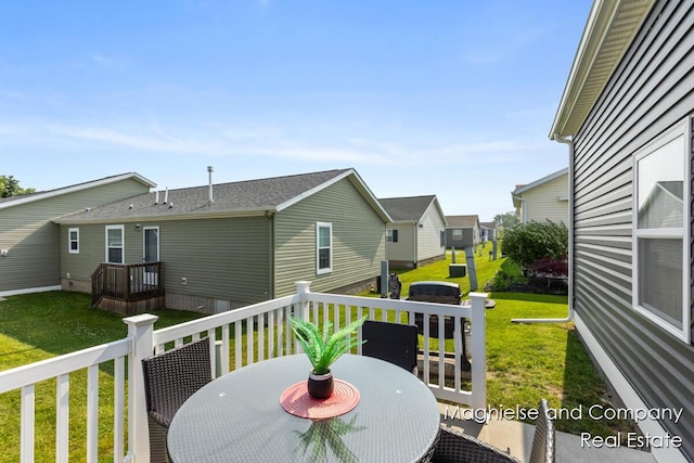 5231 E Scenic Turn Ln, Holland, MI 49423 - deck with a lawn, outdoor dining space, and a residential view