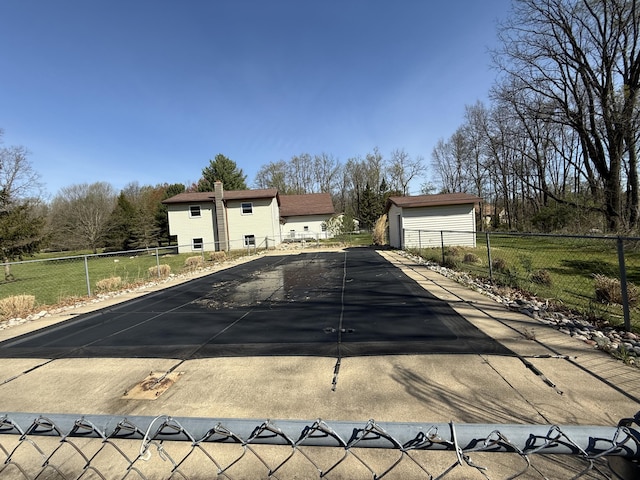 11199 Edgewood Rd, Bellevue, MI 49021 - view of swimming pool featuring an outdoor structure